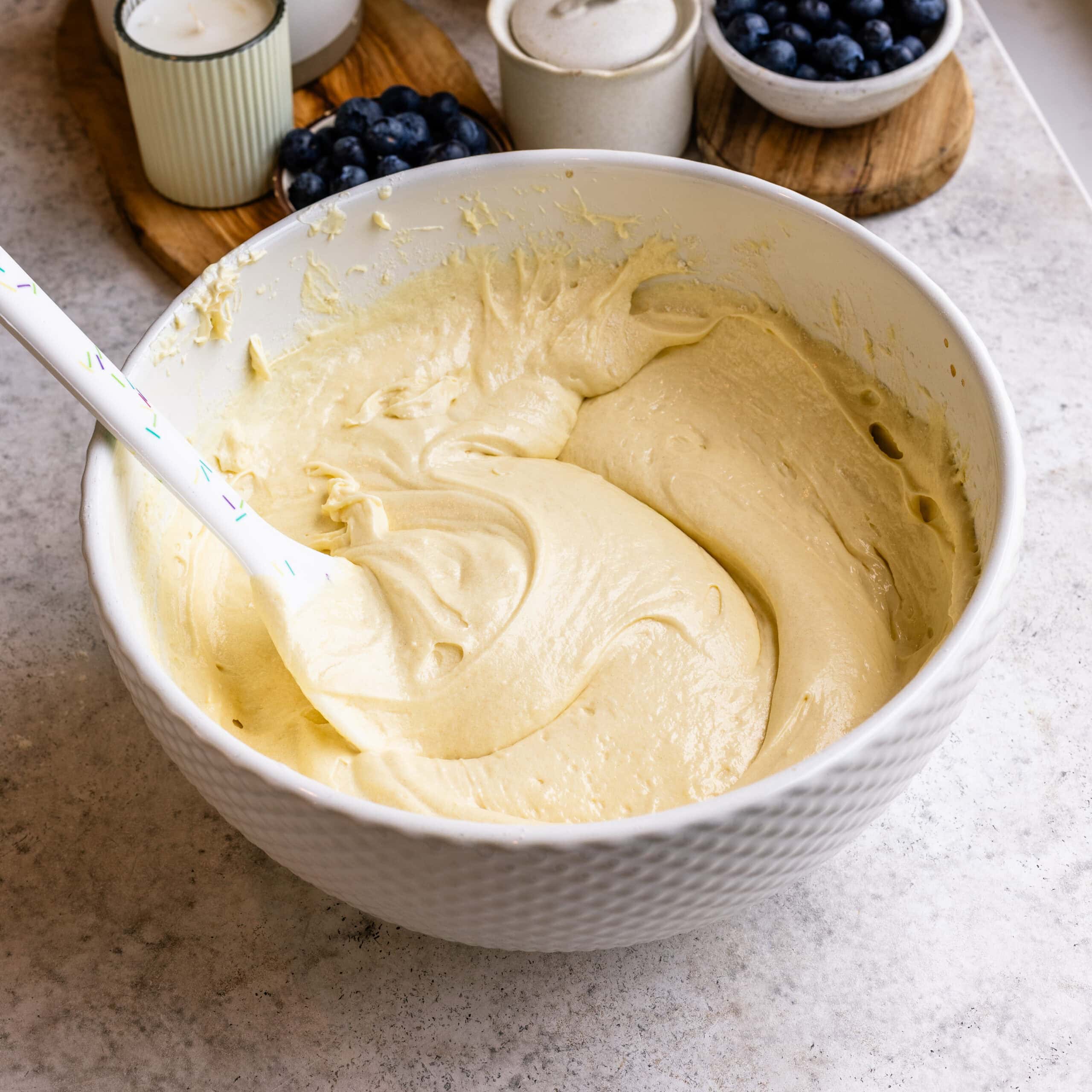 Fully mixed blueberry cake batter that is fluffy, airy, and ready for blueberries.