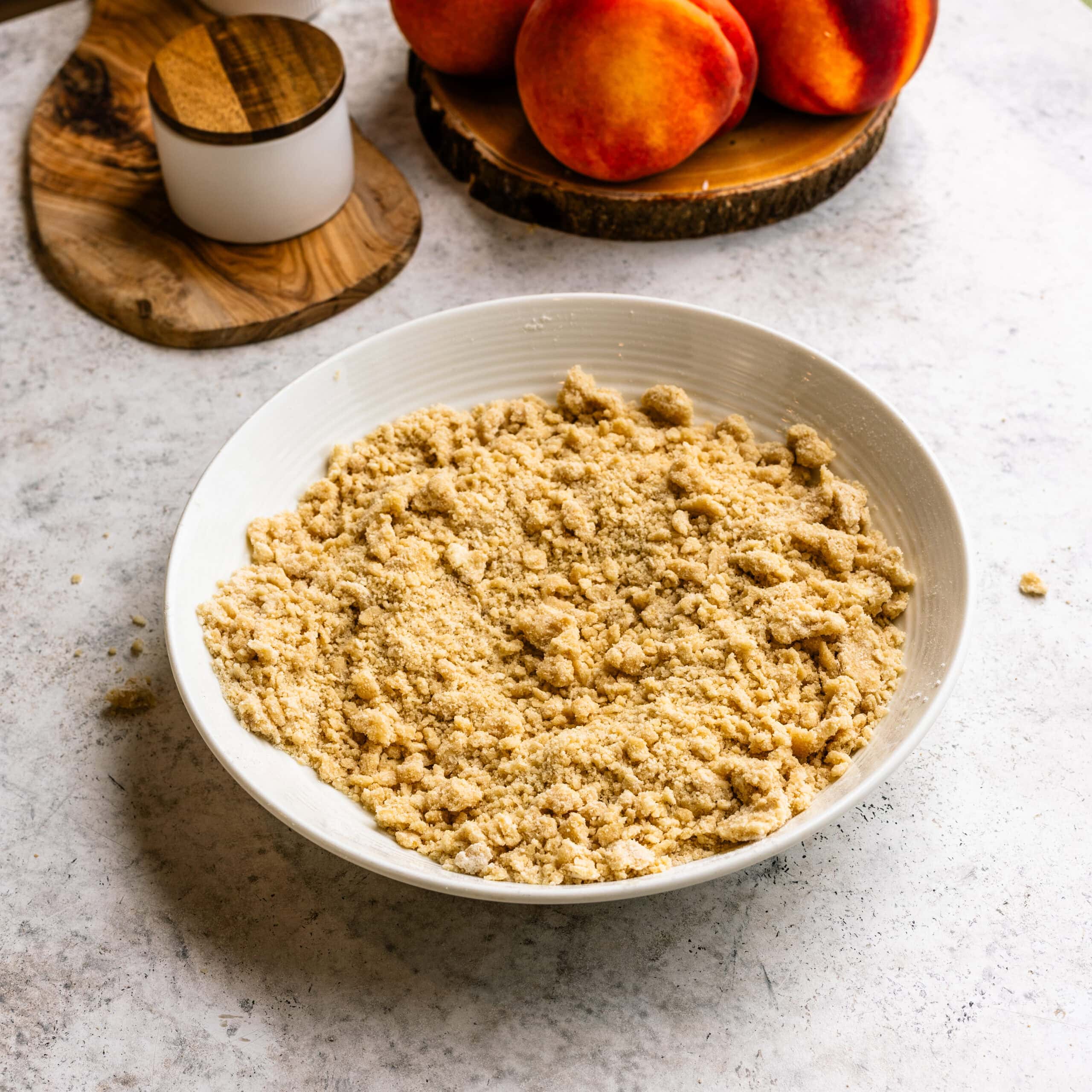 Fully mixed crumble topping for peach crumble cheesecake bars.