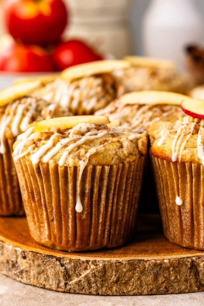 Apple muffins with cinnamon crumble topping and cream cheese glaze.